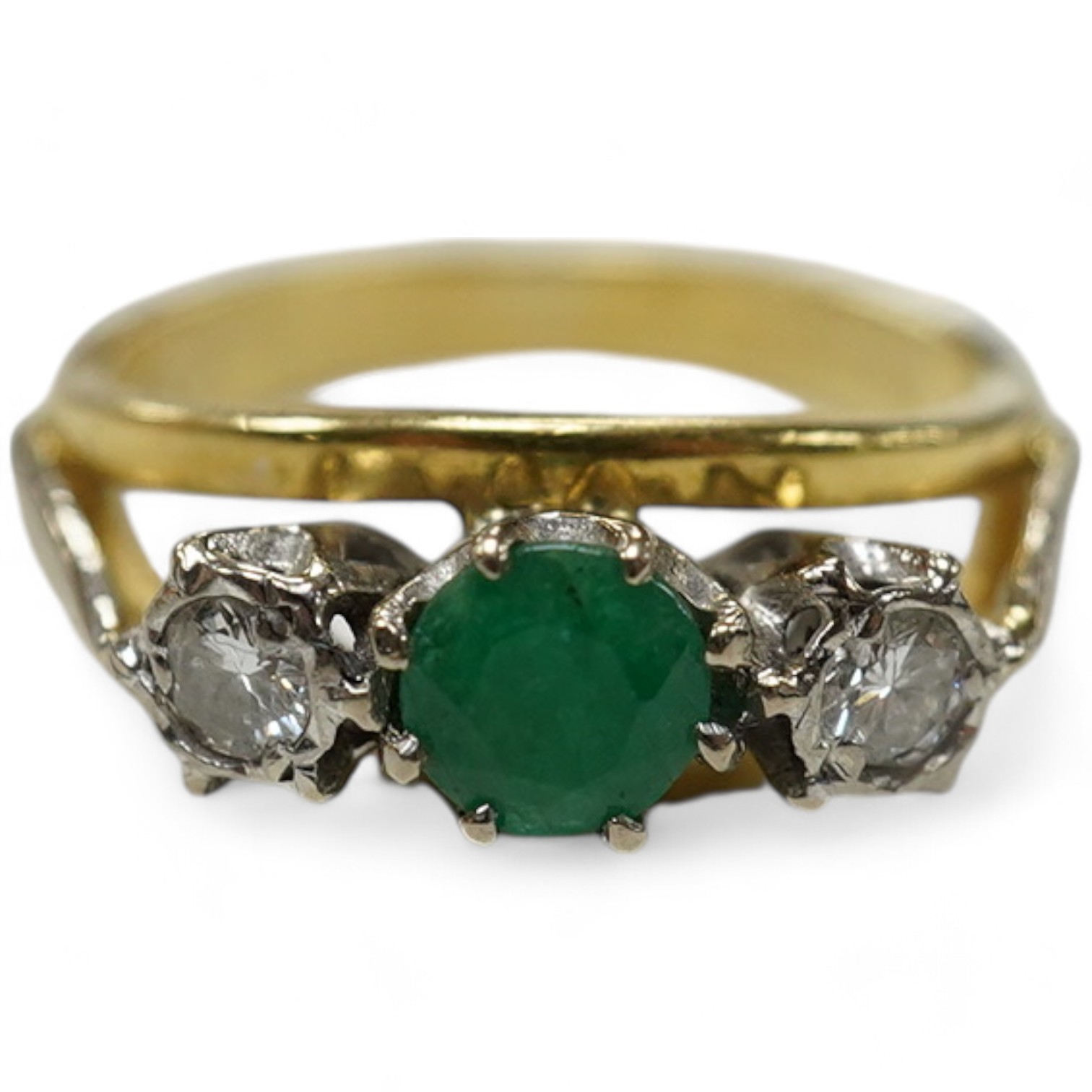 A modern yellow metal, emerald and diamond set three stone ring, size G, gross weight 3.8 grams. Condition - fair